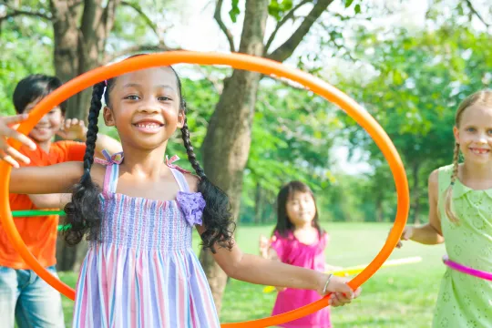 A group of kids play outside on Healthy Kids Day.
