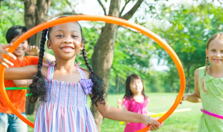 A group of kids play outside on Healthy Kids Day.